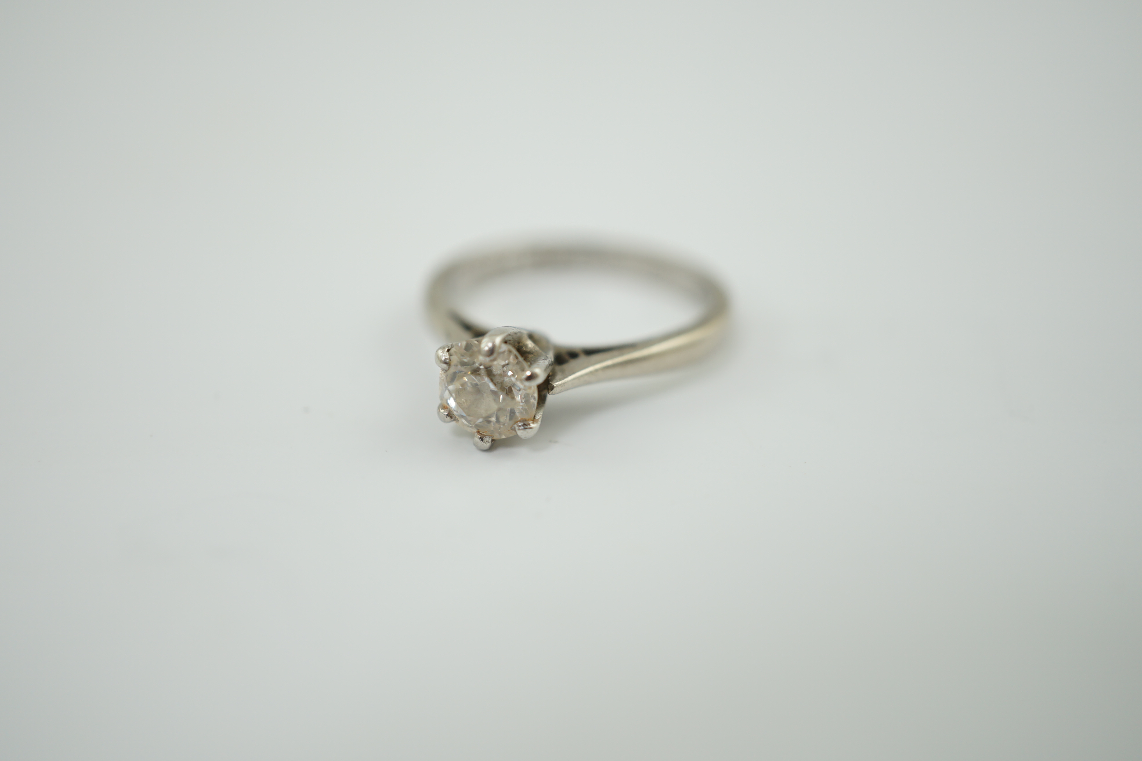 An 18ct white gold, platinum and solitaire diamond ring